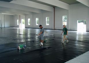 Laying of horizontal waterproofing material for hall floor