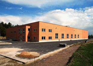 Overall view of hall, finishing paint job of the envelope and paved areas