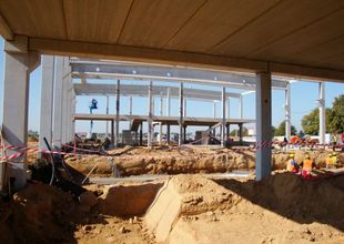 Assembly of reinforced concrete frame and excavation of assembly pits inside the structure