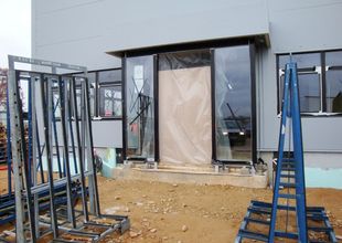 Entrance to the administrative section - installation of glass walls with automatic doors