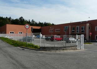 Facility entrance - view of the existing manufacturing hall and the new warehouse