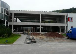 View of the facade of the new hall after the finished assembly of the reinforced concrete frame