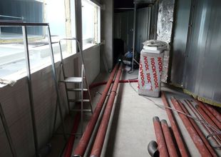 View from the 2nd floor of the extension, of the north-east wall with openings for HVAC piping