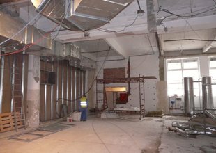 Work  in the existing hall in the free space after relocating the air-conditioning un