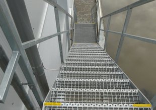 Steel staircase leading to the 2nd floor of the extension - detail of a step