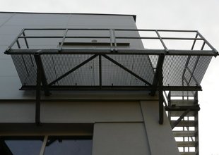 Steel staircase leading to the 2nd floor of the extension