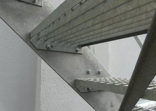 Steel staircase leading to the 2nd floor of the extension - detail of a step