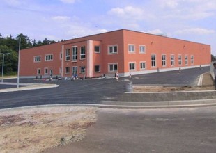 Overall view of north facade with the main entrance into the two-storey administrative in-built section